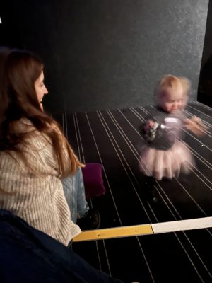 Toddler dancing in the aisle at Everyman toddler club